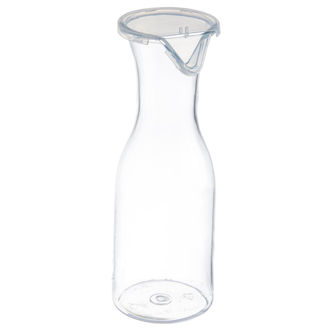 A clear, empty 36 oz polycarbonate carafe with a narrow neck, flared rim, and an attached transparent plastic lid with a spout for easy pouring. The carafe stands upright on a white background, appearing clean and minimalistic.