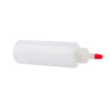 A translucent, cylindrical Chef Squeeze Bottle by TableCraft lies on its side. It features a white ribbed twist cap and a pointed red nozzle tip, perfect for dispensing glue, sauces, or other liquids. The bottle holds 4 oz.; background is plain white.