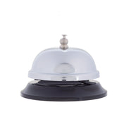 A shiny TableCraft chrome plated call bell with a round top and button sits on a black plastic base. The bell is centered against a plain white background, its reflective surface catching the light.