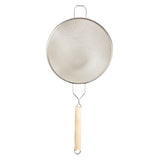 A tinned metal mesh strainer with a double fine mesh wire screen, round frame, and a long wooden handle with a metal hanging loop. A small metal loop opposite the handle adds stability when placed over a pot or bowl.