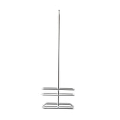 A tall, freestanding TableCraft metal toilet paper holder with a vertical pole and two horizontal tiers at the base for holding multiple rolls. This rack only features a minimalist, chrome plated finish and open design, standing upright against a plain white background.