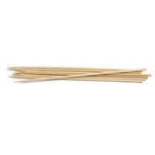 A small pile of TableCraft bamboo skewers lies on a white background. The 10 inch skewers are thin, cylindrical, light beige in color, and have sharp pointed tips for grilling or holding together pieces of food.
