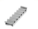 A metal taco holder with six wave-shaped slots sits on a white background. The shiny, stainless steel taco prep tray keeps tacos upright and separated, and is also dishwasher safe for easy cleaning.