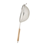 A metal wire strainer with a double medium mesh features a round bowl and a long wooden handle with a metal loop for hanging. The strainer is pictured against a plain white background.