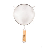 A metal strainer with a double medium mesh and a round stainless steel frame. It features a wooden handle with a metal loop for hanging, plus two small support hooks on the rim. The background is white.
