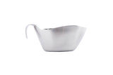 A stainless steel gravy boat with a smooth, matte finish. Dishwasher safe, it features a curved, wide spout and a single handle on the left side. Set against a plain white background, its simple, modern design stands out.