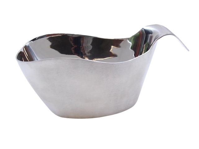 A shiny, modern stainless steel gravy boat with smooth, wavy edges and a long, upward-curved spout. Its reflective surface shows distorted reflections, and the curved handle at the back ensures easy pouring. Dishwasher safe for effortless cleanup.