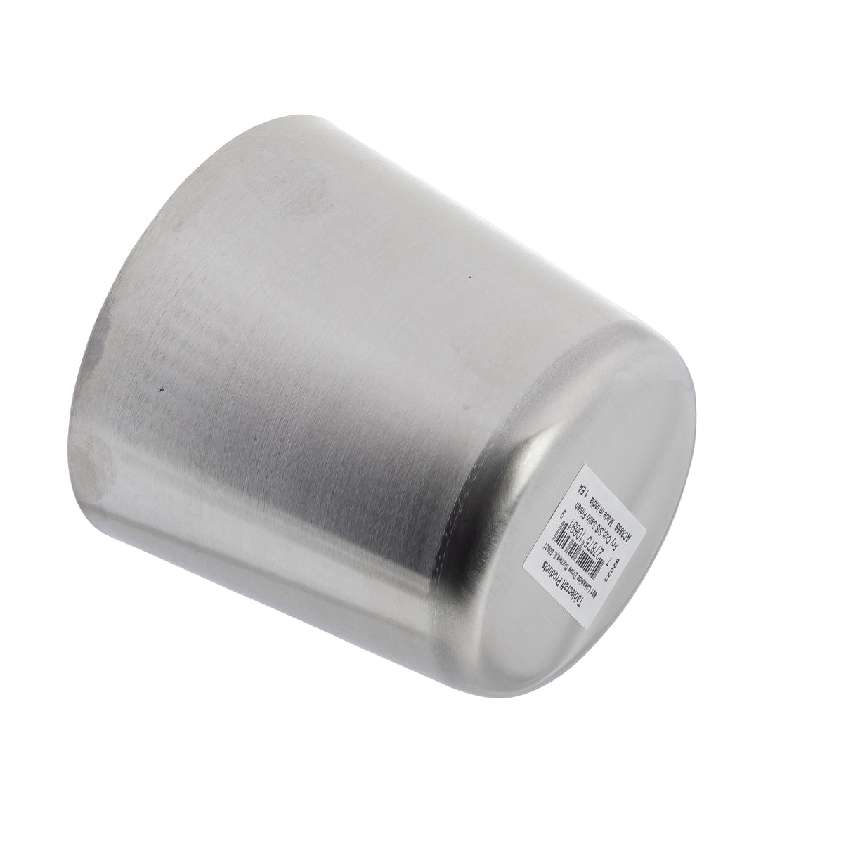 A brushed stainless steel Fry Cup lies on its side with the open end facing left. A white barcode sticker with black text and numbers is attached to the base. The plain white background highlights its metallic surface and subtle reflections.