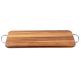 The TableCraft Acacia Display Board is a rectangular wooden cutting board with natural wood grain patterns, featuring a smooth surface and rounded edges. Each short end has a metal handle, making the board easy to lift and carry. Photographed against white.