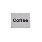 A rectangular stainless steel coffee sign with the word "Coffee" printed in bold black letters at the center. The bottom corners are slightly rounded, and the background is plain white—ideal for a buffet tent setup.