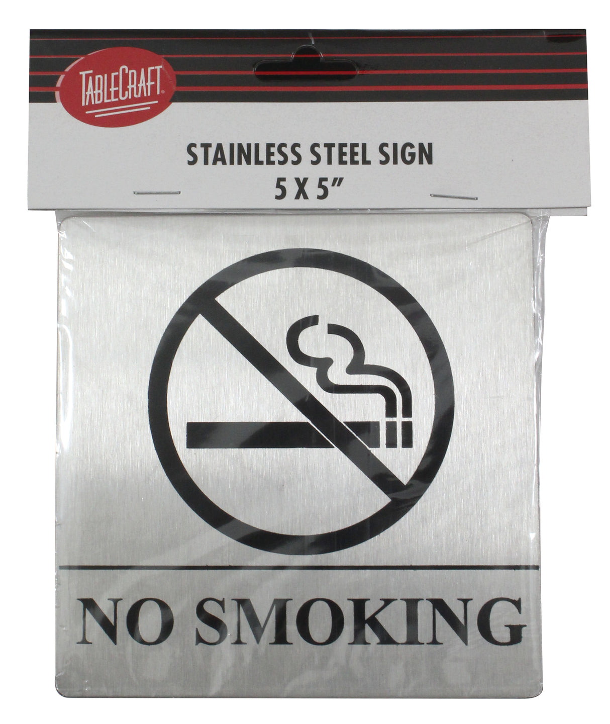 A stainless steel No Smoking sign features a clear symbol—a cigarette with smoke crossed out—and bold NO SMOKING text below. It includes pressure sensitive adhesive for easy mounting and comes in packaging with the TableCraft logo and product details.
