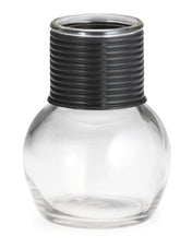 A clear, round glass hottle with a wide base and narrow neck is topped with a thick, textured black plastic collar featuring horizontal grooves. This empty 10 oz container is photographed against a white background.