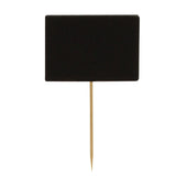 A small, rectangular black sign resembling a chalkboard is attached to a slender bamboo pick with a pointed end. The sign stands vertically, perfect for plant markers or labeling, and has a plain white background.