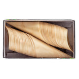 A rectangular box contains two neatly stacked rows of thin, leaf-shaped biodegradable pinewood serving dishes, curved and overlapping like fans, with a light natural wood color and smooth, eco-friendly texture.
