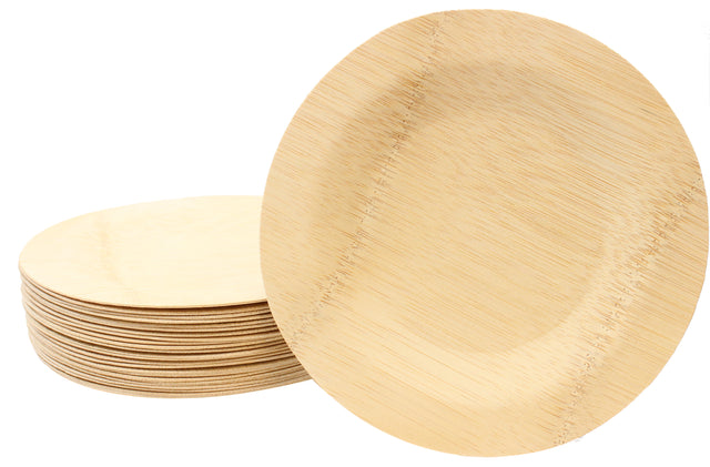 A stack of round, light-colored TableCraft disposable bamboo plates is shown. One 11 inch plate is propped upright in front, highlighting its smooth surface, visible natural grain patterns, and eco-friendly, biodegradable design.