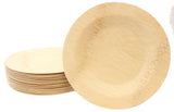 A stack of round, light tan-colored TableCraft disposable bamboo plates, with one 9 inch plate propped upright in front. The plates feature visible wood grain and stitching details, highlighting their eco-friendly, biodegradable design.