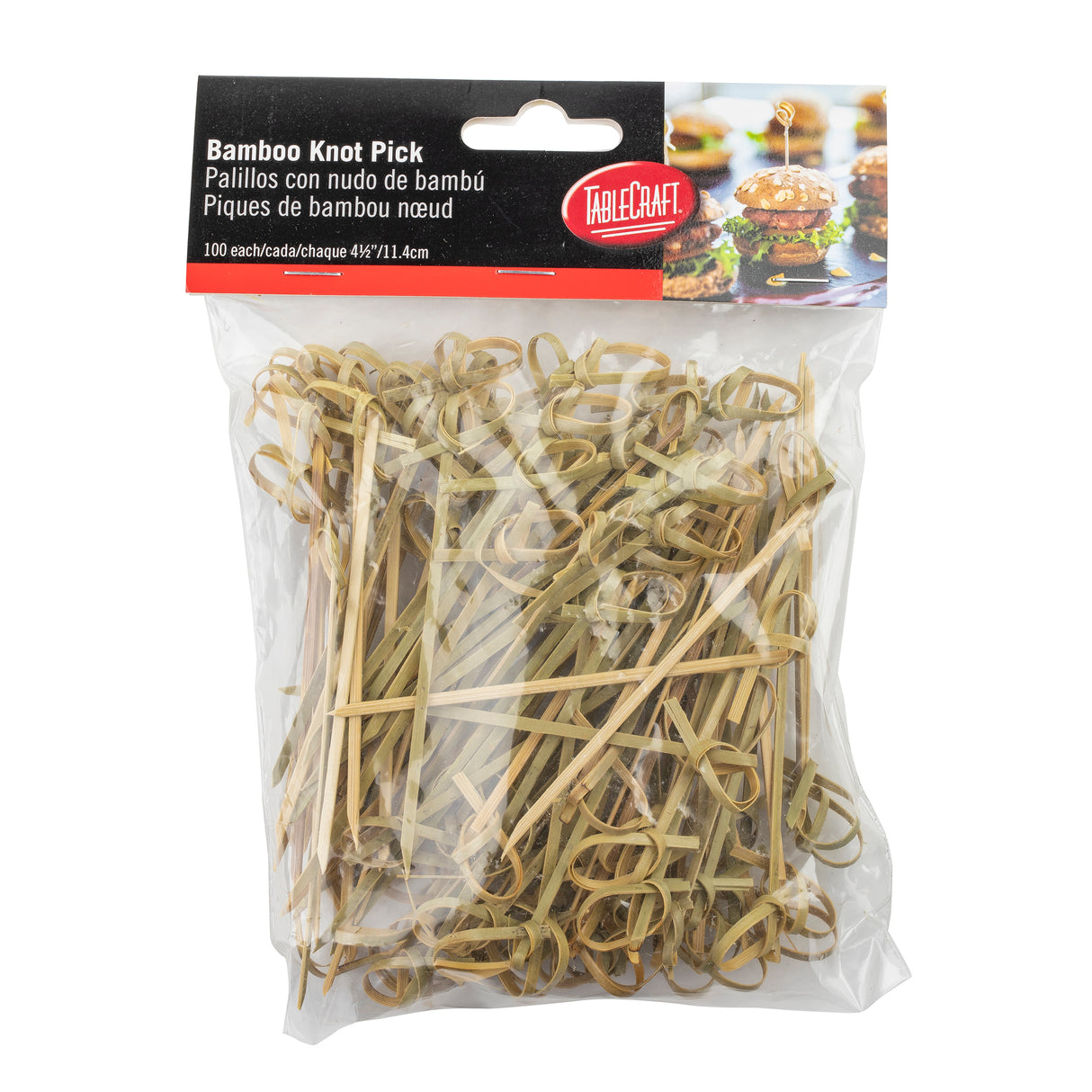A clear plastic bag of TableCraft bamboo knot picks is shown, containing 100 light brown picks twisted into small knots. Each bamboo knot pick measures 4.5 inches (11.4 cm) and is perfect for serving appetizers or sandwiches.