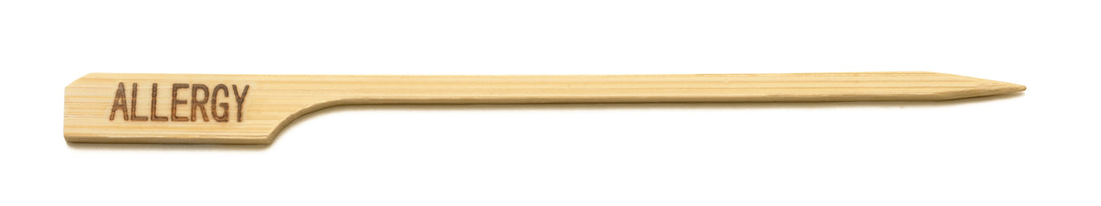 A bamboo Allergy Pick from TableCraft Products, featuring a flat handle labeled “ALLERGY” in dark letters. Its pointed end slides easily into food, while the wide, rectangular handle ensures clear visibility against a plain white background.