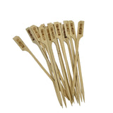 A group of TableCraft Products bamboo picks with flat, paddle-shaped tops lies on a white background. The tops are stamped “GLUTEN-FREE” in bold letters, clearly identifying each as a Gluten-Free Pick for safe food options.