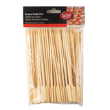 A clear plastic bag contains 100 TableCraft bamboo paddle picks with flat paddle-shaped tops. The label reads Bamboo Paddle Pick, notes the 7 inch (17.8 cm) size, and shows appetizers to inspire your next gathering.