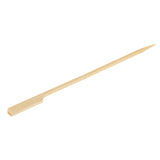 A single TableCraft bamboo paddle pick, 7 inch long, with one pointed end and one flat end, isolated on a white background. The slender, smooth pick is light brown and typically used for grilling or serving foods such as kebabs.