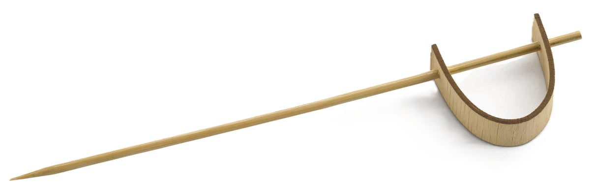 A TableCraft bamboo cocktail pick with a pointed end and a curved loop at the top, forming a semi-circular decorative handle. The pick lies on a white background, showcasing its visually interesting sword pick-inspired design.