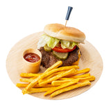 A cheeseburger with lettuce, tomato, pickles, and a TableCraft sport pick on a bun sits on a round wooden plate. French fries are arranged beside it, and a small cup of ketchup is next to the fries. The background is white.