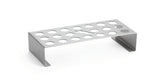 A stainless steel, rectangular laboratory test tube rack with two short legs. The top features multiple round holes for holding test tubes, a droplet-shaped cone holder, and rests on a plain white background.