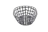 A black powder coated metal serving basket from the Complexity Collection is shown against a white background. Its round, open grid pattern features intersecting strips, creating an airy geometric structure with a wide top tapering to a flat base.