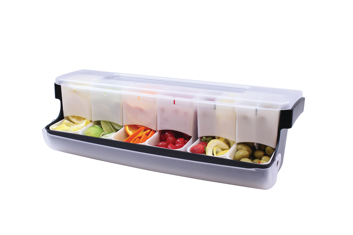 A rectangular plastic garnish station with a transparent lid, featuring six compartments. Each compartment is filled with fresh sliced fruits, vegetables, or garnishes—perfect for organized service and maintaining first in first out rotation.
