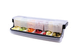 A rectangular plastic garnish station with a transparent lid, featuring six compartments. Each compartment is filled with fresh sliced fruits, vegetables, or garnishes—perfect for organized service and maintaining first in first out rotation.