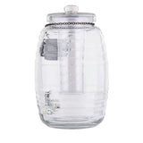 A large, clear, ribbed glass jar with a matching lid and vertical cylindrical insert inside. The TableCraft glass beverage dispenser features a decorative black chain with a metallic tag encircling the top. The jar is empty and stands upright.