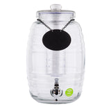 A clear, ribbed glass beverage dispenser by TableCraft sits upright with a silver spigot. It features a round glass lid, a black chalkboard label on a chain, and an infuser tube inside—perfect as a Beehive Beverage Dispenser. Green sticker at bottom right.