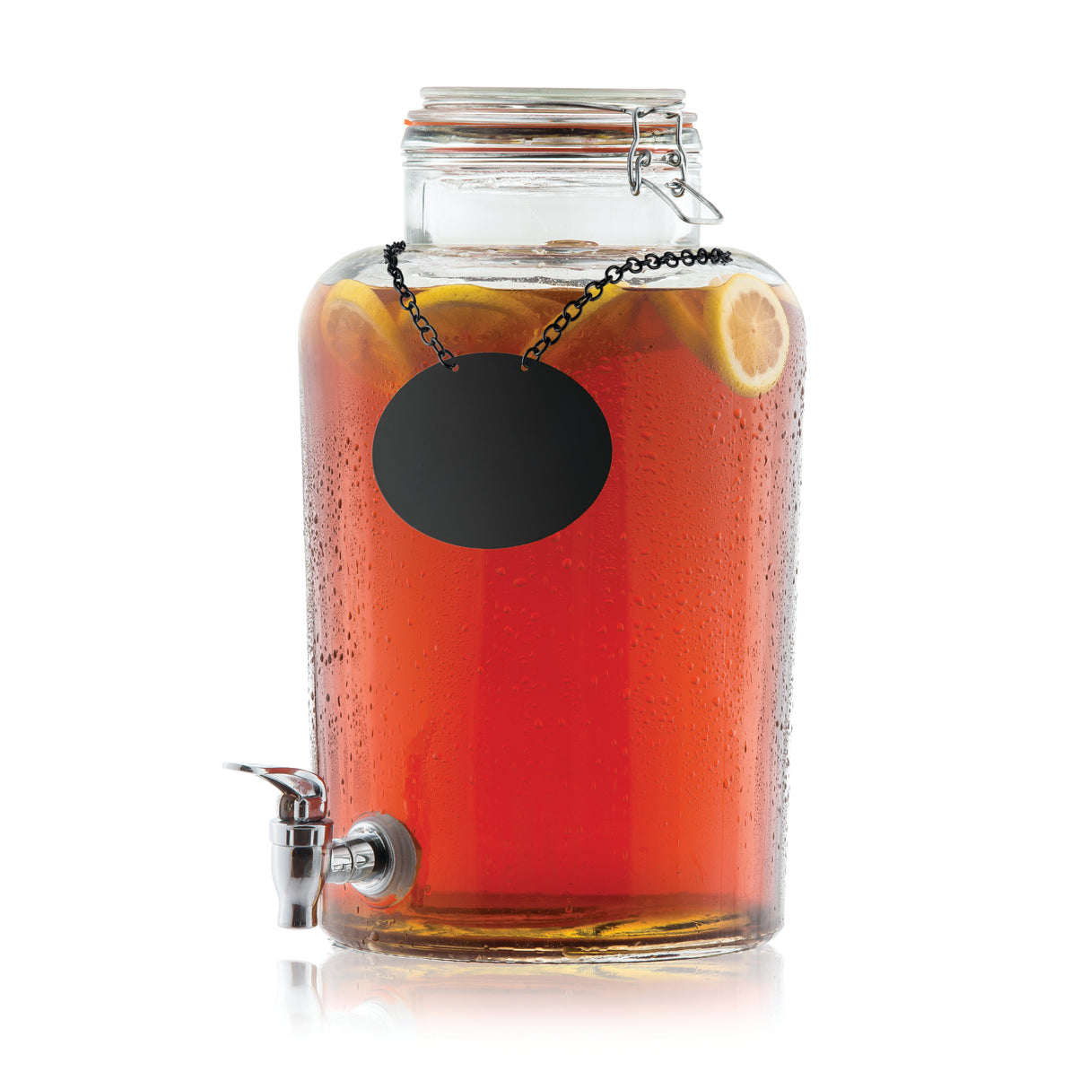 A Rustic beverage dispenser filled with iced tea and lemon slices features a metal spigot, clasp lid, and blank black label hanging from a chain. Condensation on the 2.5 gallon beverage dispenser adds a refreshing touch.