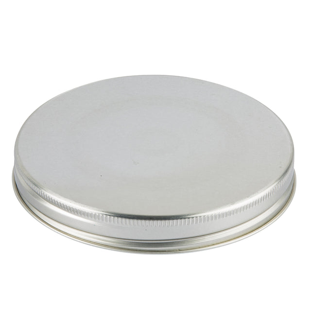 A round, flat silver metal Replacement Top with a smooth top and a textured, ridged edge. Ideal for a Mason Jar Beverage Dispenser, the lid appears unused and clean against a white background. It is also dishwasher safe for easy cleaning.