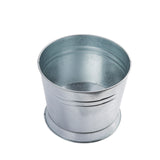 A shiny, metallic, cylindrical galvanized tub made of galvanized steel is shown on a white background. The bucket has smooth sides, a round open top, and no handle. Its reflective surface and simple TableCraft Products design are clearly visible.