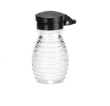 A clear, ribbed glass syrup dispenser with a black plastic flip-top lid is centered on a white background. Dishwasher safe and easy to clean, it’s perfect for pouring syrup or similar liquids while matching beehive salt/pepper shakers.