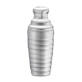 A shiny, stainless steel bar shaker with a ribbed, cylindrical body and a rounded cap, isolated on a white background. The shaker has a smooth, reflective surface and a modern, sleek design.