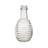 A clear 6 oz glass bottle with a narrow neck and wide, rounded body featuring evenly spaced horizontal ridges. Ideal as a replacement jar for oil/vinegar, the empty bottle is photographed against a plain white background.