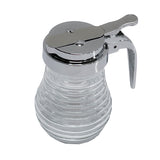 A clear, ribbed glass syrup dispenser from the TableCraft Beehive Collection with a shiny chrome lid and metal handle. The lid features a lever mechanism for pouring and a small round hole, all atop an empty, rounded base.