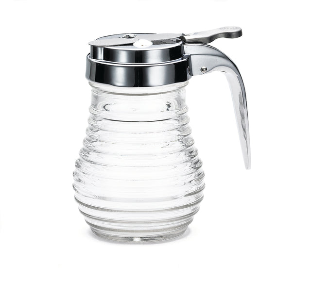 A clear, ribbed glass Syrup dispenser from the Beehive Collection by TableCraft, featuring a shiny metal lid with a lever for pouring and a small circular opening. The empty dispenser is photographed against a plain white background.