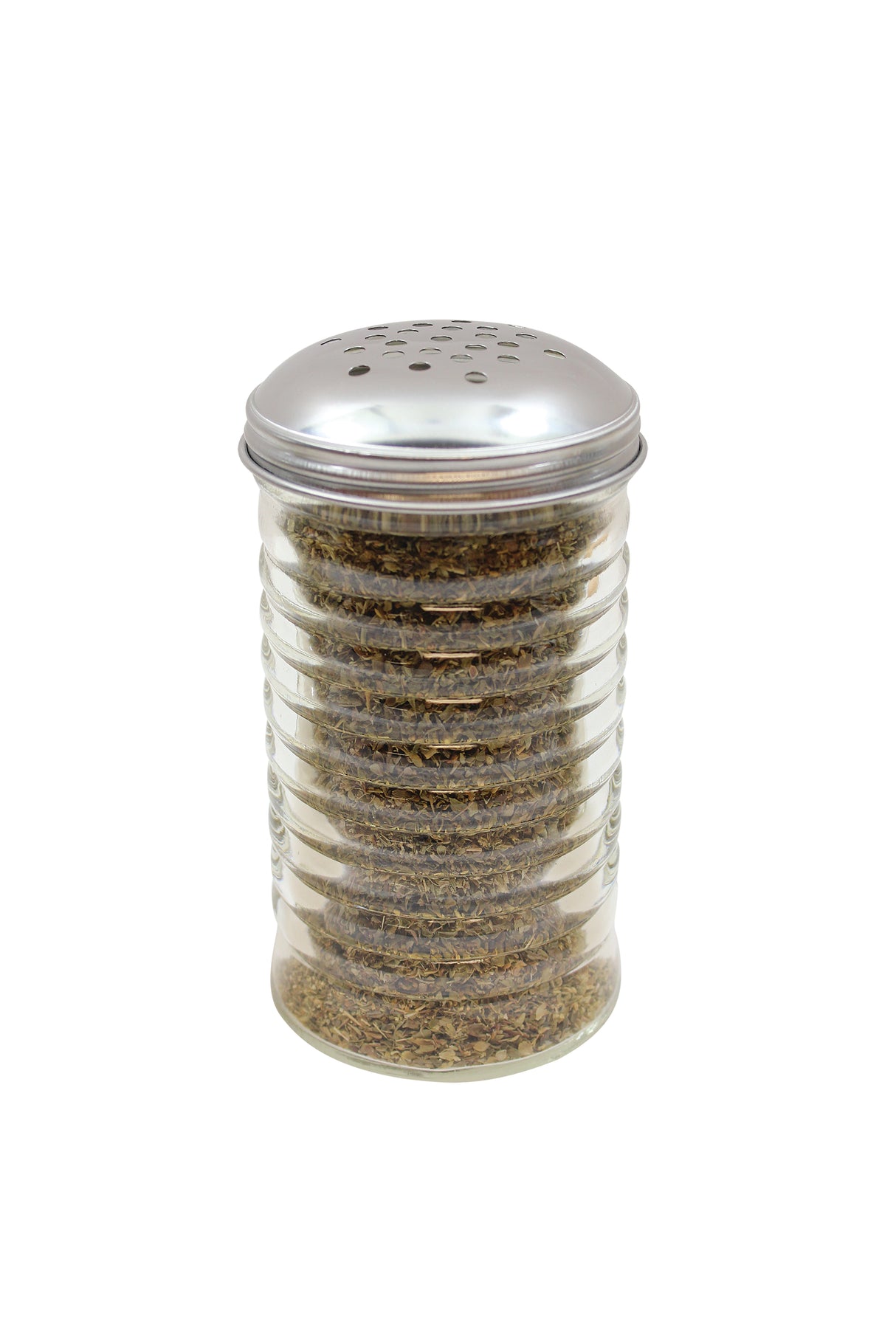 A clear ribbed glass spice shaker from the TableCraft Beehive Collection, filled with dried oregano and topped with a perforated silver metal lid, sits on a white background. The greenish-brown herb is visible through the cheese shaker's glass.