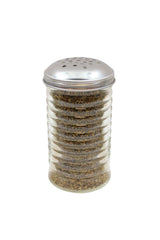 A clear ribbed glass spice shaker from the TableCraft Beehive Collection, filled with dried oregano and topped with a perforated silver metal lid, sits on a white background. The greenish-brown herb is visible through the cheese shaker's glass.
