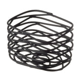 A stack of six irregular, interlocking Black Powder Coated Metal bangles forms an abstract, twisted geometric shape. Thin and unevenly shaped, they create a modern, sculptural look against a plain white background—part of our Artisan Collection.