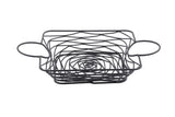 A square, black powder coated metal wire basket with open sides and a spiral pattern on the bottom. Part of the Artisan Collection Basket line, it features two large oval handles and is set empty against a plain white background.