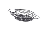 A black powder coated metal, oval-shaped Artisan Collection basket with open sides, swirled wire patterns, and two rounded handles on each end. The basket sits on a white background.