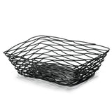 A black powder coated metal basket with wavy, geometric lines forms a modern, open lattice pattern. This rectangular serving basket from the Artisan Collection features slightly flared sides and a dynamic, airy design.