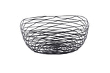 A round, open Artisan Collection Basket made of black powder coated metal with a spiral, crisscross pattern. This modern and airy TableCraft BK17310 basket sits empty against a plain white background, offering a lightweight decorative touch.