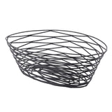 A modern oval Artisan Collection Basket, crafted from black powder coated metal. Its open, crisscrossing pattern and irregularly angled lines create a geometric, airy look. This TableCraft BK17410 basket sits flat with no handles for a sleek finish.