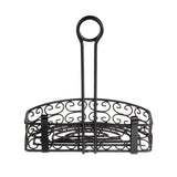 A black powder coated metal caddy with decorative swirl patterns, a rectangular base, and a high, circular handle. This ornate merchandising rack, inspired by the Mediterranean Versa Rack style, features open sides and sturdy vertical bars for support.